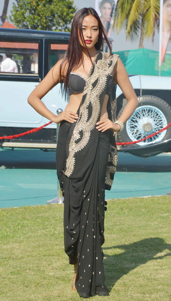 model in black embroidery saree