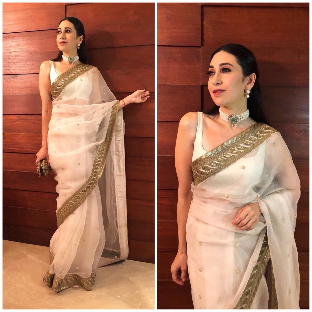 karishma kapoor radiant look in a white saree from sabyasachi with embroide...